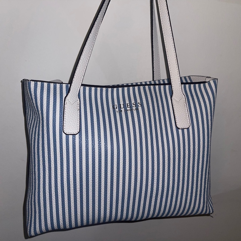 Blue and white strips guess bag. Size: XL